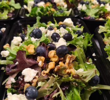 Mixed green salad with blueberries and feta