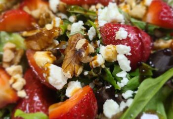Strawberry and mixed green salad with walnuts